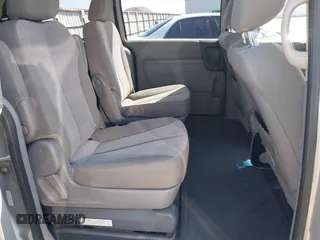 2012 Kia Sedona LX with VIN KNDMG4C70C6491703, listed as a IAAI auction lot 42128411 with 246,586 mi miles. Bid and sale history available at carsss.com. Image 8.