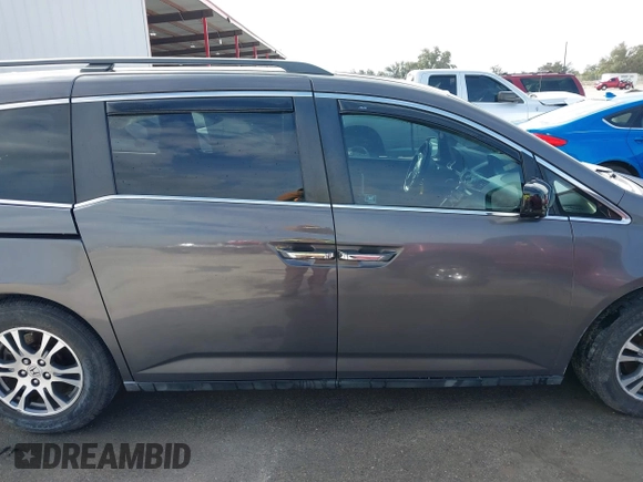 2012 Honda Odyssey EX-L with VIN 5FNRL5H60CB094682, listed as a IAAI auction lot 41570797 with 127,890 mi miles and . Bid and sale history available at carsss.com. Image 13.