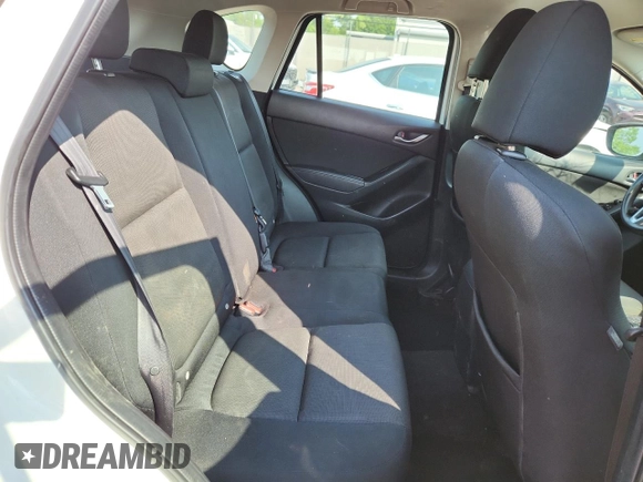 2016 Mazda CX-5 Sport with VIN JM3KE4BYXG0704194, listed as a Copart auction lot 62095735 with 93,970 mi miles and Salvage title. Bid and sale history available at DreamBid. Image 11.