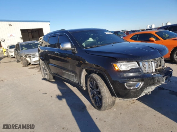 2017 Jeep Grand Cherokee Overland with VIN 1C4RJECGXHC659417, listed as a Copart auction lot 80168894 with 118,934 mi miles and Salvage Title. Bid and sale history available at carsss.com. Image 4.