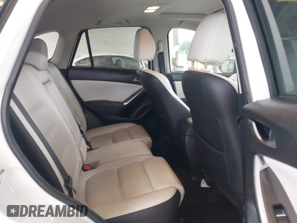 2016 Mazda CX-5 Grand Touring with VIN JM3KE2DYXG0675619, listed as a IAAI auction lot 42137144 with 106,262 mi miles and . Bid and sale history available at DreamBid. Image 8.
