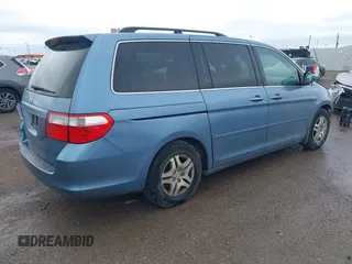 2007 Honda Odyssey EX-L z VIN 5FNRL38647B139018, wystawiony jako IAAI lot #41712602 z przebiegiem 243 473 mil mil oraz . Historia ofert i sprzedaży dostępna na DreamBid. Obrazek 4.