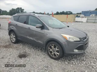 2013 Ford Escape SEL z VIN 1FMCU9HX7DUC11052, wystawiony jako Copart lot #62377515 z przebiegiem 225 704 mil mil oraz Szkoda całkowita • Salvage title. Historia ofert i sprzedaży dostępna na DreamBid. Obrazek 4.