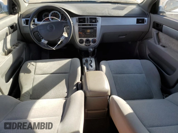 2004 Suzuki Forenza S z VIN KL5JD52Z14K950658, wystawiony jako Copart lot #74824154 z przebiegiem 99 150 mil mil oraz Tytuł czysty. Historia ofert i sprzedaży dostępna na DreamBid. Obrazek 8.