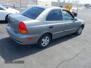 2003 Hyundai Accent GL with VIN KMHCG45C73U471607, listed as a IAAI auction lot 41956551 with 222,305 mi miles. Bid and sale history available at carsss.com. Image 4.