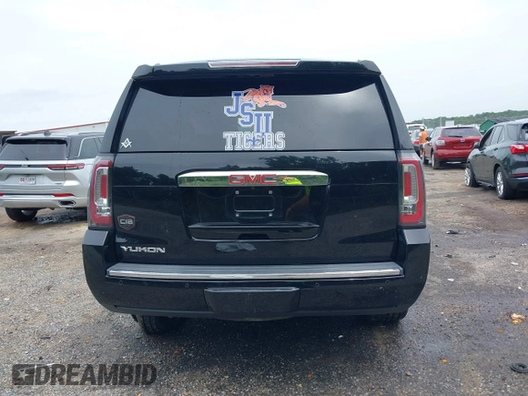2016 GMC Yukon Denali with VIN 1GKS1CKJXGR254306, listed as a IAAI auction lot 39953539 with 164,149 mi miles. Bid and sale history available at carsss.com. Image 16.