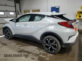 2021 Toyota C-HR LE z VIN NMTKHMBX2MR140040, wystawiony jako Copart lot #50598335 z przebiegiem Nie podano mil oraz Szkoda całkowita • Salvage title. Historia ofert i sprzedaży dostępna na DreamBid. Obrazek 2.