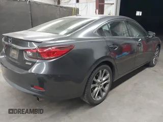 2015 Mazda 6 i Grand Touring with VIN JM1GJ1W58F1199550, listed as a IAAI auction lot 42064381 with 145,465 mi miles and . Bid and sale history available at carsss.com. Image 4.