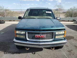 1997 GMC Suburban z VIN 3GKGK26J0VG522963, wystawiony jako Copart lot #56804105 z przebiegiem 297 544 mil mil oraz Tytuł czysty. Historia ofert i sprzedaży dostępna na DreamBid. Obrazek 5.