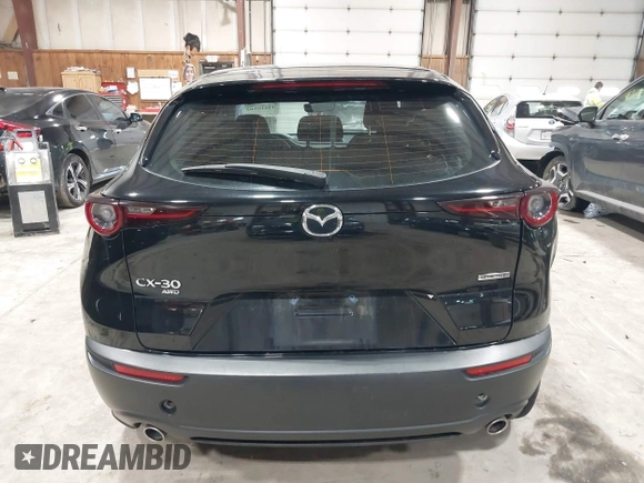 2021 Mazda CX-30 S with VIN 3MVDMBAL0MM226504, listed as a IAAI auction lot 41619102 with 87,998 mi miles and . Bid and sale history available at carsss.com. Image 16.