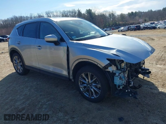 2021 Mazda CX-5 Grand Touring Reserve with VIN JM3KFBAY5M0472988, listed as a IAAI auction lot 41897855 with 27,318 mi miles. Bid and sale history available at carsss.com. Image 1.