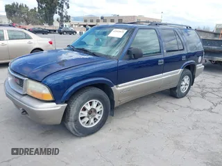 1999 GMC Jimmy SLE with VIN 1GKDT13W8X2526345, listed as a IAAI auction lot 41919975 with 164,214 mi miles. Bid and sale history available at carsss.com. Image 2.