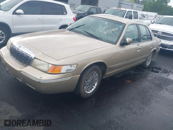 1999 Mercury Grand Marquis GS z VIN 2MEFM74W4XX645430, wystawiony jako IAAI lot #42154522 z przebiegiem 152 306 mil mil oraz . Historia ofert i sprzedaży dostępna na DreamBid. Obrazek 2.