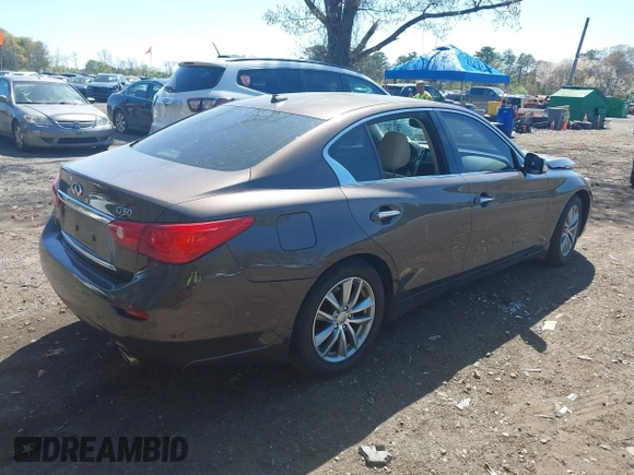 2014 Infiniti Q50 Premium with VIN JN1BV7ARXEM684719, listed as a IAAI auction lot 42122949 with 126,656 mi miles and . Bid and sale history available at DreamBid. Image 4.