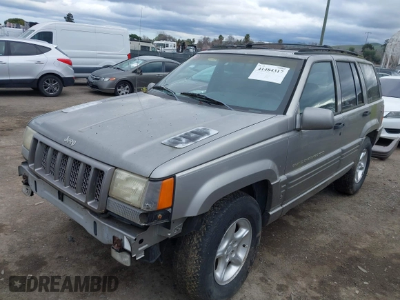 1998 Jeep Grand Cherokee Limited with VIN 1J4GZ88Z7WC223496, listed as a IAAI auction lot 41484317 with 244,567 mi miles. Bid and sale history available at carsss.com. Image 2.