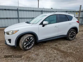 2016 Mazda CX-5 Grand Touring z VIN JM3KE2DY4G0732770, wystawiony jako Copart lot #58314665 z przebiegiem 92 587 mil mil oraz Czysty tytuł • Clean title. Historia ofert i sprzedaży dostępna na DreamBid. Obrazek 1.