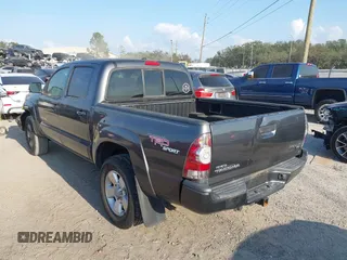 2011 Toyota Tacoma PreRunner with VIN 3TMJU4GN6BM117602, listed as a IAAI auction lot 41483053 with 209,591 mi miles and . Bid and sale history available at DreamBid. Image 3.
