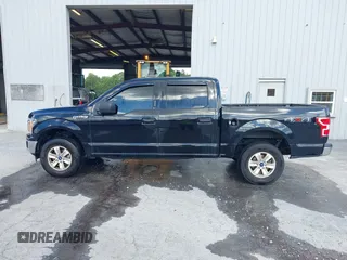 2019 Ford F-150 XL with VIN 1FTEW1E56KFA63764, listed as a IAAI auction lot 42410872 with 124,648 mi miles and . Bid and sale history available at DreamBid. Image 14.
