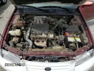 1999 Toyota Camry LE z VIN JT2BF22K8X0181675, wystawiony jako Copart lot #55057875 z przebiegiem 184 657 mil mil oraz Szkoda całkowita • Salvage title. Historia ofert i sprzedaży dostępna na DreamBid. Obrazek 11.