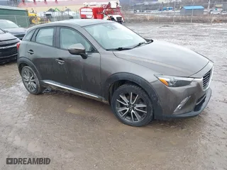 2016 Mazda CX-3 Grand Touring with VIN JM1DKBD77G0107328, listed as a IAAI auction lot 41682949 with 156,935 mi miles. Bid and sale history available at carsss.com. Image 1.