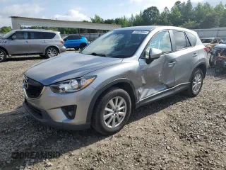 2014 Mazda CX-5 Touring z VIN JM3KE2CY0E0412733, wystawiony jako Copart lot #55803865 z przebiegiem 161 539 mil mil oraz Szkoda całkowita • Salvage title. Historia ofert i sprzedaży dostępna na DreamBid. Obrazek 1.