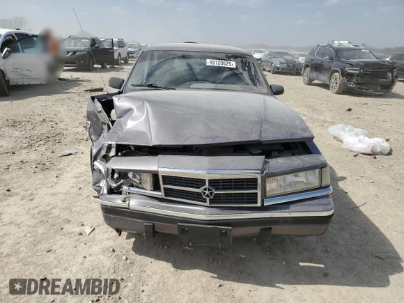 1993 Dodge Dynasty z VIN 1B3XC4638PD195963, wystawiony jako Copart lot #49120625 z przebiegiem 86 825 mil mil oraz Szkoda całkowita • Salvage title. Historia ofert i sprzedaży dostępna na DreamBid. Obrazek 5.