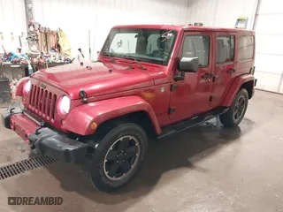 2012 Jeep Wrangler Unlimited Sahara with VIN 1C4BJWEG0CL256852, listed as a IAAI auction lot 41765640 with 171,408 mi miles. Bid and sale history available at carsss.com. Image 2.