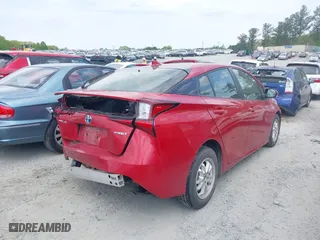 2021 Toyota Prius L Eco with VIN JTDKAMFU7M3147346, listed as a IAAI auction lot 41979206 with 55,267 mi miles. Bid and sale history available at carsss.com. Image 4.