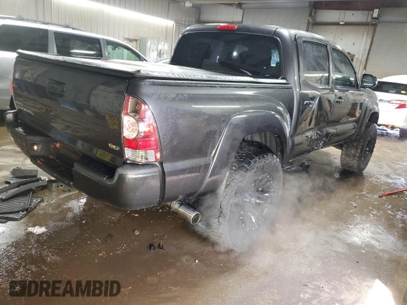 2014 Toyota Tacoma with VIN 5TFLU4ENXEX089927, listed as a Copart auction lot 52140565 with 112,924 mi miles and Salvage Title. Bid and sale history available at DreamBid. Image 3.