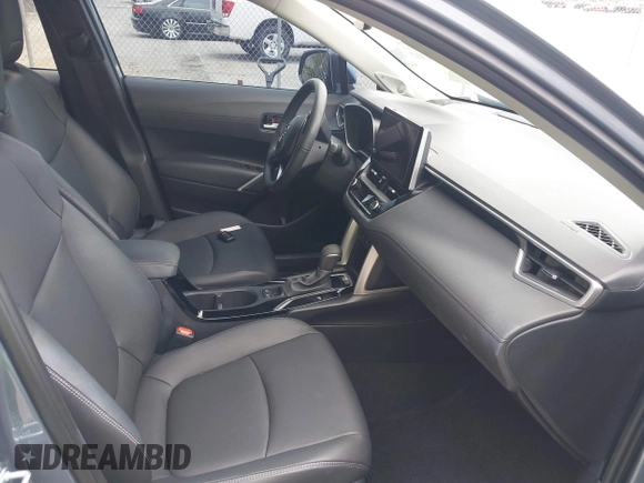 2023 Toyota Corolla Cross XLE with VIN 7MUDAAAGXPV070263, listed as a IAAI auction lot 42394307 with 18,977 mi miles and . Bid and sale history available at DreamBid. Image 5.