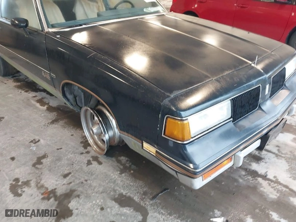 1987 OLDSMOBILE CUTLASS SUPREME with VIN 1G3GR1194HP322800, listed as a IAAI auction lot 41981142 with 155,917 mi miles. Bid and sale history available at carsss.com. Image 6.