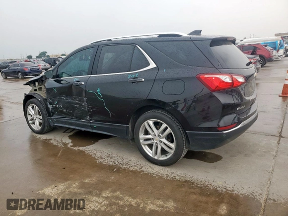 2021 Chevrolet Equinox Premier z VIN 2GNAXNEV9M6136701, wystawiony jako Copart lot #57288215 z przebiegiem 62 808 mil mil oraz Szkoda całkowita • Salvage title. Historia ofert i sprzedaży dostępna na DreamBid. Obrazek 2.