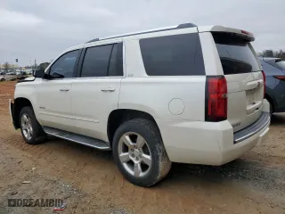 2015 Chevrolet Tahoe LTZ with VIN 1GNSCCKC3FR672168, listed as a Copart auction lot 85527284 with 160,822 mi miles and Salvage Title. Bid and sale history available at carsss.com. Image 2.