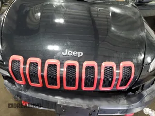 2014 Jeep Cherokee Trailhawk with VIN 1C4PJMBSXEW187981, listed as a Copart auction lot 56711885 with 157,317 mi miles and Salvage title. Bid and sale history available at DreamBid. Image 12.