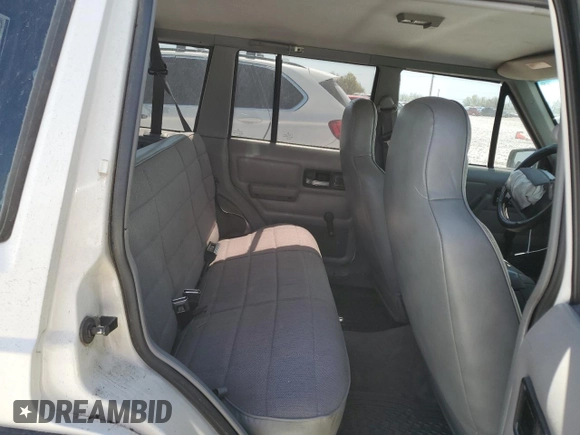 1996 Jeep Cherokee Sport with VIN 1J4FJ68S1TL128597, listed as a Copart auction lot 49600545 with 201,074 mi miles and Salvage title. Bid and sale history available at DreamBid. Image 11.