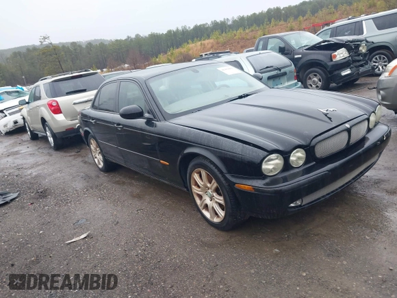 2004 Jaguar XJ with VIN SAJEA71C34SG10171, listed as a IAAI auction lot 41412081 with 150,488 mi miles. Bid and sale history available at carsss.com. Image 1.