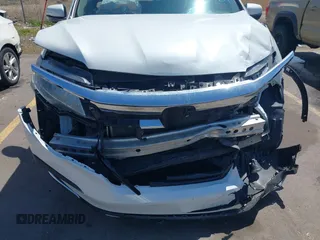 2021 Honda Pilot Touring 8-Passenger z VIN 5FNYF6H94MB087593, wystawiony jako IAAI lot #42153310 z przebiegiem 30 400 mil mil oraz . Historia ofert i sprzedaży dostępna na DreamBid. Obrazek 6.