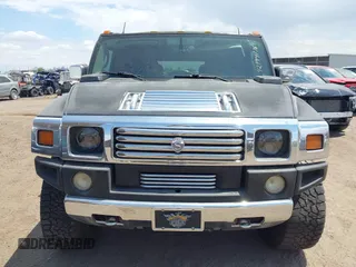 2003 Hummer H2 with VIN 5GRGN23U73H122756, listed as a IAAI auction lot 42194176 with 239,411 mi miles. Bid and sale history available at carsss.com. Image 12.