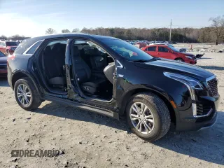 2023 Cadillac XT5 FWD Premium Luxury with VIN 1GYKNCR48PZ132957, listed as a Copart auction lot 42132845 with 27,312 mi miles and Salvage Title. Bid and sale history available at carsss.com. Image 4.