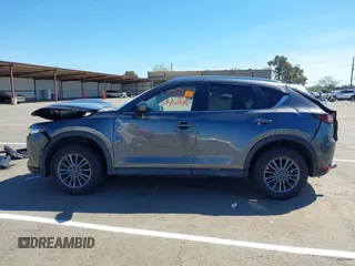 2019 Mazda CX-5 Touring with VIN JM3KFACM1K0533142, listed as a IAAI auction lot 41880181 with Not Provided miles and . Bid and sale history available at carsss.com. Image 14.