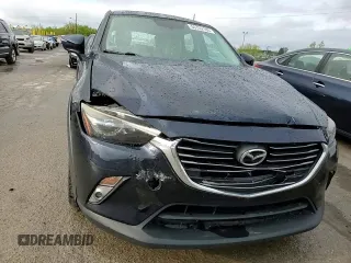 2017 Mazda CX-3 Grand Touring z VIN JM1DKFD75H0141048, wystawiony jako Copart lot #55752185 z przebiegiem 89 960 mil mil oraz Szkody całkowita. Historia ofert i sprzedaży dostępna na DreamBid. Obrazek 14.