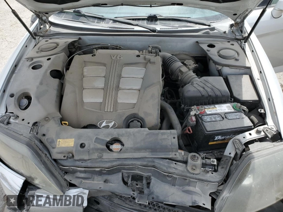 2006 Hyundai Tiburon GT z VIN KMHHN65F06U203701, wystawiony jako Copart lot #52374135 z przebiegiem 90 796 mil mil oraz Szkody całkowita. Historia ofert i sprzedaży dostępna na DreamBid. Obrazek 11.