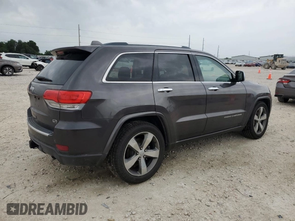 2014 Jeep Grand Cherokee Overland with VIN 1C4RJFCG9EC572237, listed as a Copart auction lot 53864865 with 90,657 mi miles and Salvage Title. Bid and sale history available at DreamBid. Image 3.