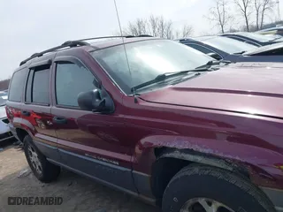 2001 Jeep Grand Cherokee Laredo with VIN 1J4GW48S51C739725, listed as a IAAI auction lot 41800431 with 220,396 mi miles. Bid and sale history available at carsss.com. Image 13.