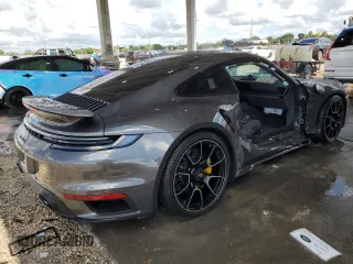 2022 Porsche 911 Turbo S z VIN WP0AD2A91NS255589, wystawiony jako Copart lot #60695644 z przebiegiem 6 562 mil mil oraz Nie do naprawy • Non repairable. Historia ofert i sprzedaży dostępna na DreamBid. Obrazek 3.