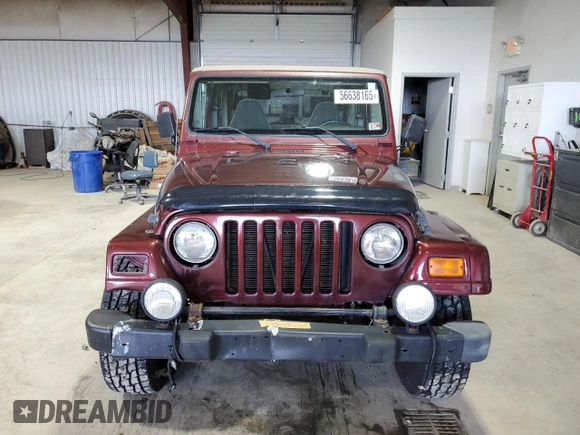 2002 Jeep Wrangler Sahara с VIN 1J4FA59S62P751858, выставлен на аукционе Copart как лот 56638165 с пробегом 270 770 миль миль и Списание • Salvage title. История ставок и продаж доступна на DreamBid. Изображение 5.