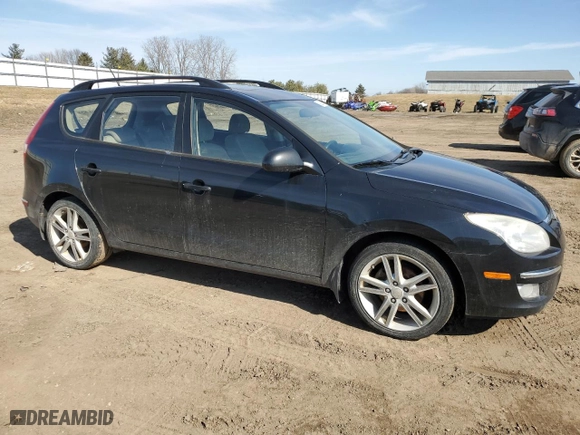 2010 Hyundai Elantra Touring GLS with VIN KMHDC8AE2AU052608, listed as a Copart auction lot 48223555 with 208,329 mi miles and Clean Title. Bid and sale history available at carsss.com. Image 4.