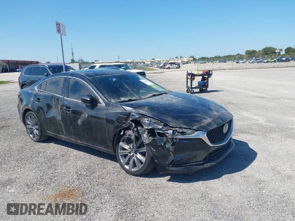 2020 Mazda 6 Touring with VIN JM1GL1VMXL1517828, listed as a IAAI auction lot 41511804 with 123,174 mi miles. Bid and sale history available at carsss.com. Image 1.