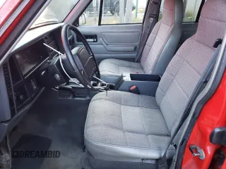 1996 Jeep Cherokee Sport with VIN 1J4FJ68S8TL285995, listed as a Copart auction lot 73333574 with 187,429 mi miles and Salvage Title. Bid and sale history available at carsss.com. Image 7.