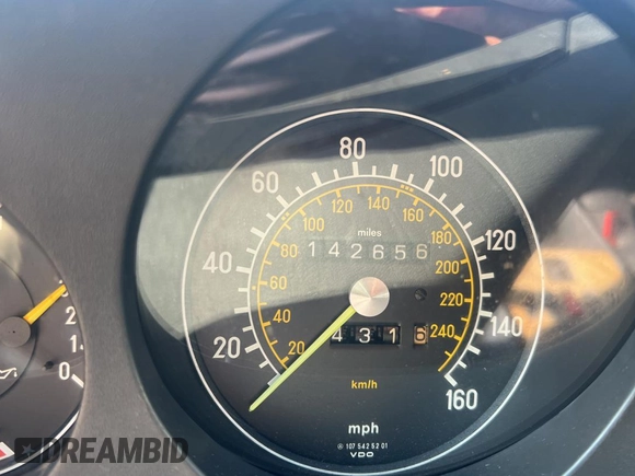1984 Mercedes-Benz SL with VIN WDB1070421A009542, listed as a Copart auction lot 65327125 with 142,656 mi miles and Clean title. Bid and sale history available at DreamBid. Image 8.